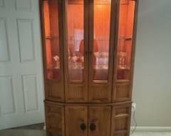 Beautiful hardwood, lit, curio cabinet holds all the delicate and special items.