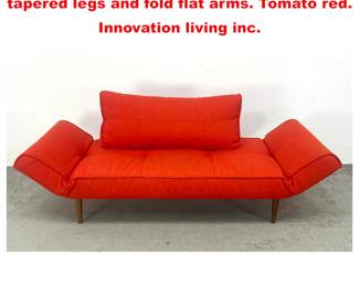 Lot 1754 Danish style settee daybed with tapered legs and fold flat arms. Tomato red. Innovation living inc. 