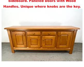 Lot 1565 French Elm Wood Credenza Sideboard. Paneled Doors with Wood Handles. Unique where knobs are the key.