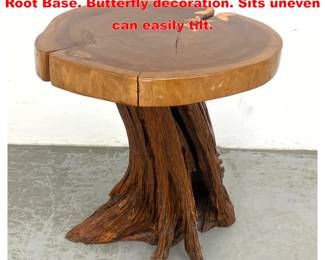 Lot 1420 Thick Slab Sap edge Table with Root Base. Butterfly decoration. Sits uneven can easily tilt.