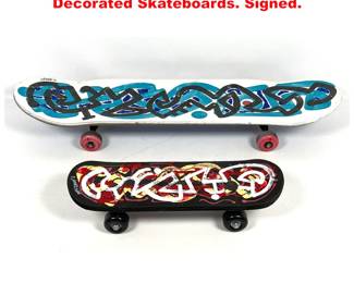 Lot 1243 2pcs DENNIS SAKELSON Decorated Skateboards. Signed.
