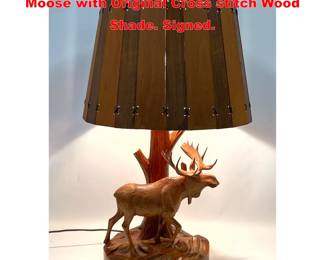 Lot 1567 DUBE Carved wood Table Lamp. Moose with Original Cross stitch Wood Shade. Signed. 