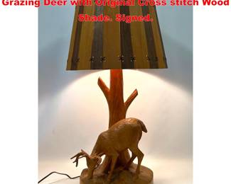Lot 1569 DUBE Carved wood Table Lamp. Grazing Deer with Original Cross stitch Wood Shade. Signed. 