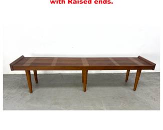 Lot 1279 Contemporary modern Slat Bench with Raised ends. 