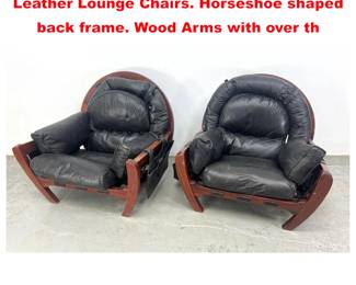 Lot 1200 Pr LUCIANO FRIGERIO Black Leather Lounge Chairs. Horseshoe shaped back frame. Wood Arms with over th