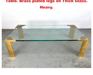 Lot 1465 Large Lorin Marsh Style Coffee Table. Brass plated legs on Thick Glass. Heavy. 