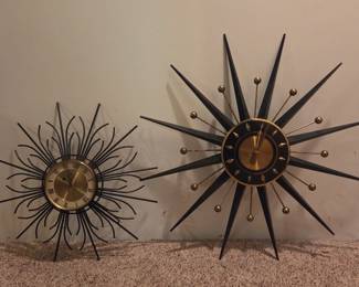  Vintage Starburst Clocks.
Left, 12" diameter metal.
Right, 20" diameter metal, brass and walnut wood.