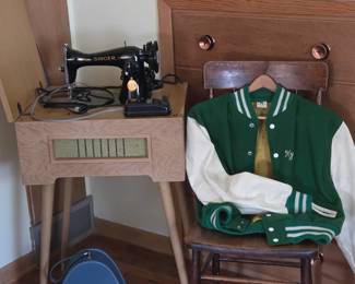 Vintage Singer sewing machine in Mid-Century cabinet, 1979 Benson Jacket, small blue suitcase.