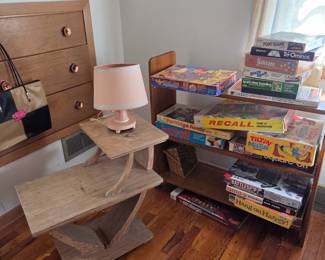 Wooden bookcase, vintage games in original boxes, wooden 1950's "Mary Had a Little Lamb" lamp.
Two tier end table- has some water damage on the top tier- very heavy and solid!