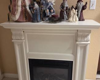 Framed electric fireplace and Santa's 