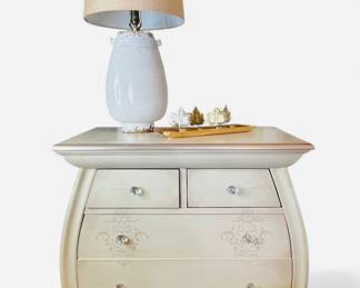 Wooden bombe chest of drawers in French Provincial style. Set of 2