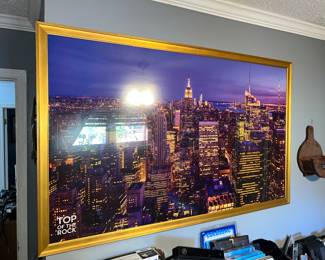 framed panoramic image of the New York City skyline at night
