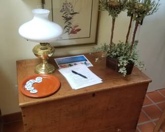 Blanket chest; table lamp