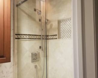 Glass shower doors with barn-style hardware