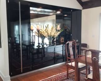 Black lacquer built-in dining room storage with lights & mirror