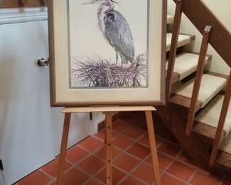 Carved avian easel; artwork