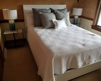 Queen bed; two end tables; two table lamps