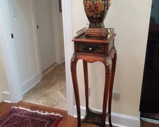 Elegant accent table; vase