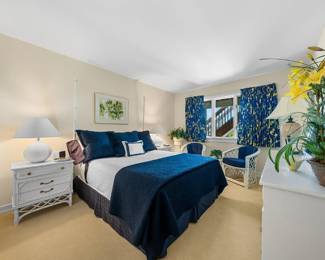 Ficks Reed queen bedroom suite: bed; two nightstands; dresser with mirror