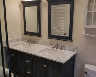 Navy blue double bath vanity; mirrors; vanity lights