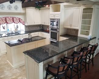 Kitchen with bar peninsula; four bar stools 
