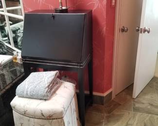 Black slant stop desk; upholstered stool