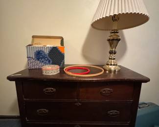 Vintage dresser, lamp, sewing patterns.