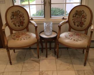 Pair of Baker arm chairs, small round table with stone top, glass vase