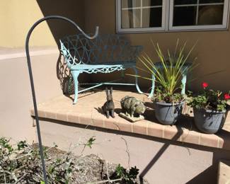 Shepherds hook, cement cat 16” long, cement pig, metal rabbit, verdigris table 16” h x 19” diameter, verdigris settee 40”x20”x31” high & potted plants