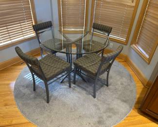 Round glass table, 4 chairs, rug