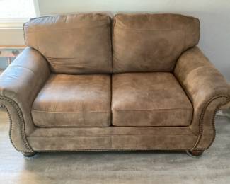 Brown suede love seat