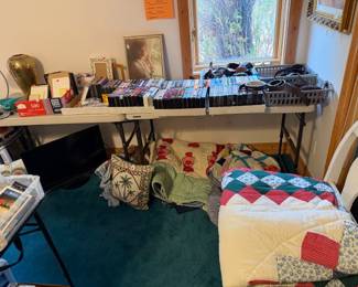 VHS tapes, quilts, small TV