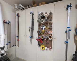 Large clamps, various tapes, plastic sheeting, wood veneer, misc.  About half sold.