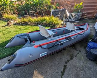 14' boat.  Comes with new in box accessories, cover, carrying bag, rear wheels that flip up when in water and down when pulling into shore.  I also have a trolling motor, lithium 100AH battery and a trailer project for sale meant for this boat.