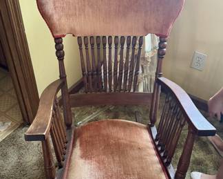 Antique wooden rocker with upholstery