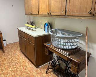 Antique sewing machine cabinet, clothes baskets