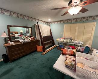Rice bed, dresser with mirror and lots of linen 
