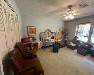 Metal headboard, office chairs, suitcases and baskets 