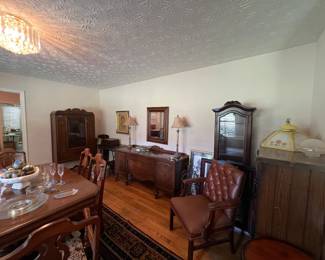 Dining room table with six chairs, china cabinet and buffet.  Vintage light fixture.  Antique mirror.