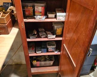 Assorted Nails and Screws, Wooden Cabinet, Light Bulb