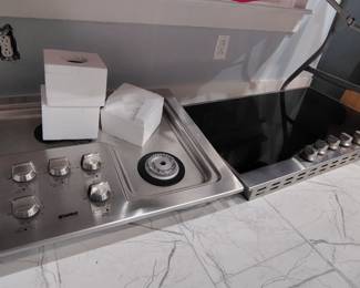 2 new range stoves. One is a wonderful Kenmore elite 5 burner gas stove. New in box
The other is a viking D3 new in box