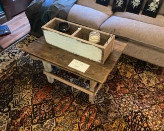 Unique candle box in area, rug, and side, a coffee table