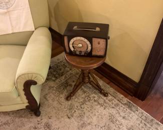 Antique piano stool, an antique radio