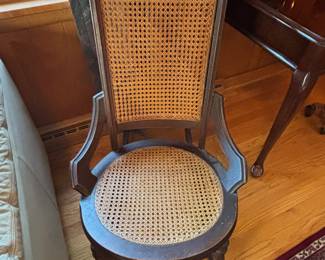 Caned back and seat of wood frame rocker
