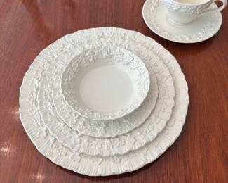 Wedgewood "Queensware" cream on cream 5 piece place setting.  Set includes:  13 dinner plates, salad plates, 11 dessert plates, 12 berry bowls, 17 saucers and 16 cups