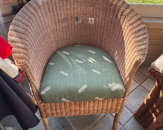 Wicker chair with dragonfly cushon