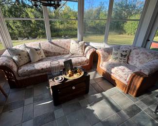 Bassett rattan sofa and chair with upholstered cushions.
