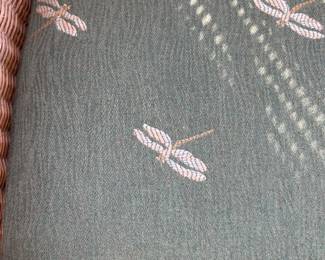 Dragonfly fabric detail on wicker chair