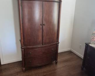 TV, clothing armoire with king bedroom suite