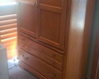 Armoire lots of shelving drawers work smoothly 50.00 need your own help to move and load !!